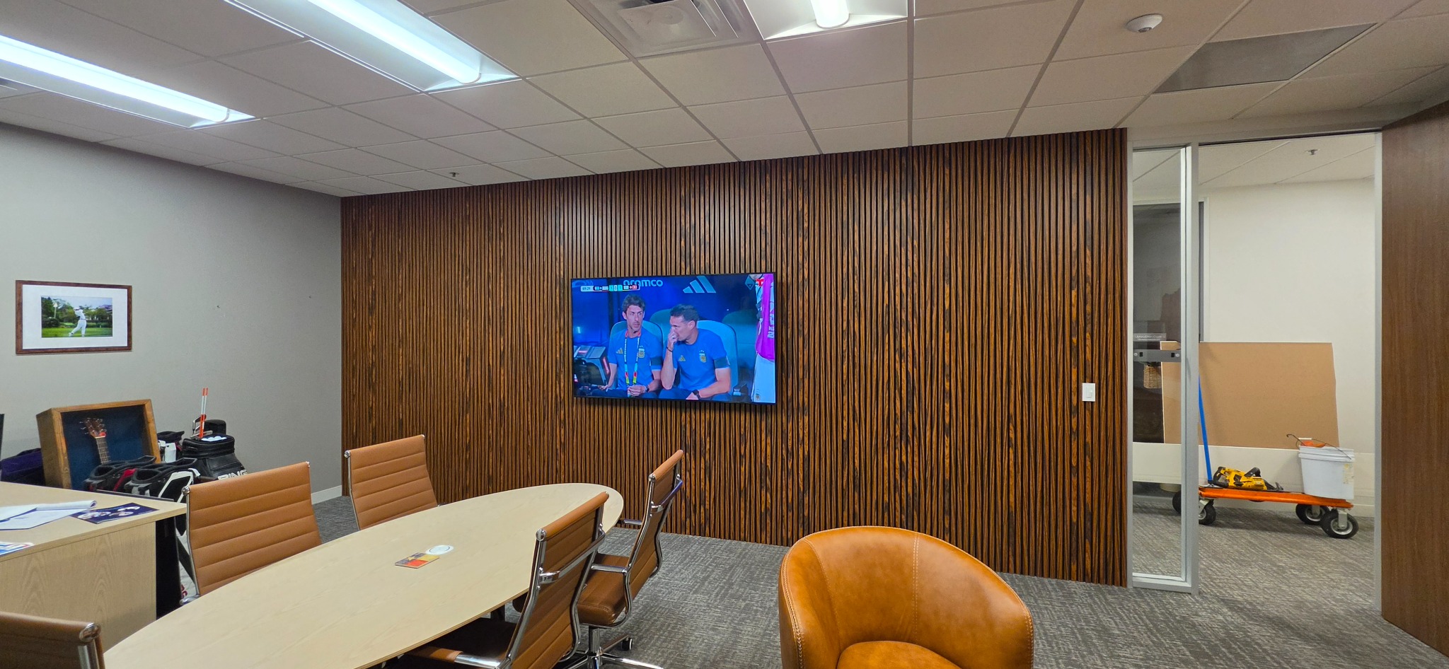 Conference room accent wall and TV installation